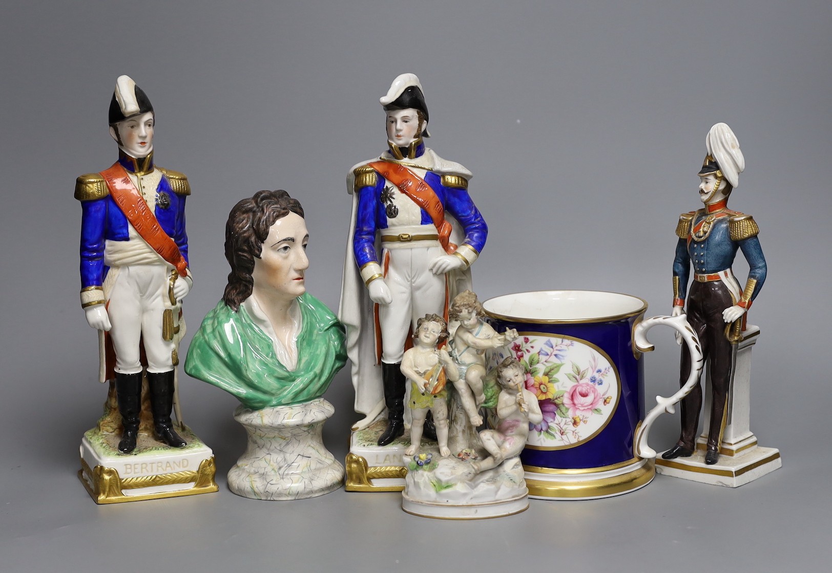 A Staffordshire bust inscribed Locke and three military figures, a two handled tankard and a cherub group, bust 19 cms high